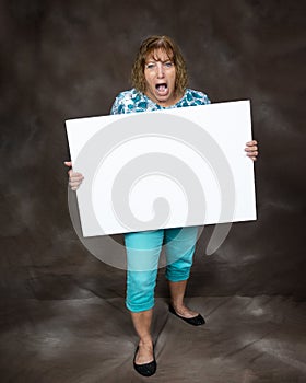 Furious Screaming Woman Holding Blank Sign photo