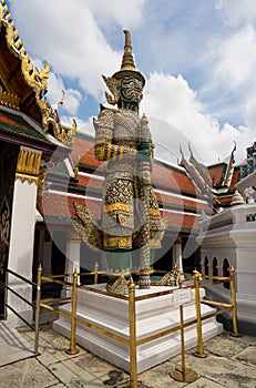 Vertical shot of the giant demon guardian statue in the Emerald Buddha Temple in Bangkok, Thailand