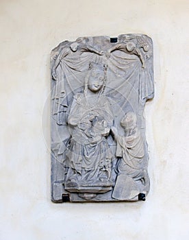 Vertical shot of a Goddess and a worshipper carving in Magdeburg`s cathedral