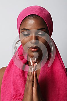 Vertical shot of gorgeous African American woman wears traditional turban.