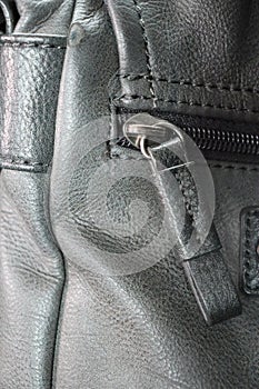 Vertical shot of a gray purse
