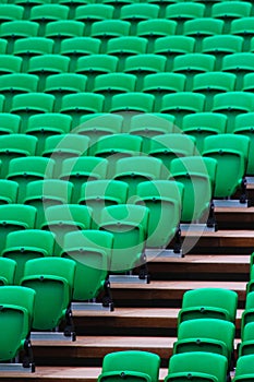 Vertical shot of green stadium seats and staris