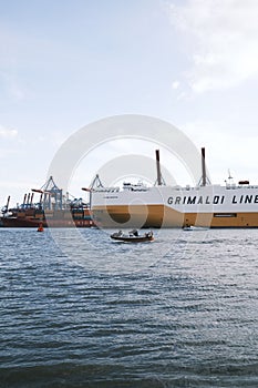 Vertical shot of the Grimaldi line cargo ship on the waters of the port of Hamburg