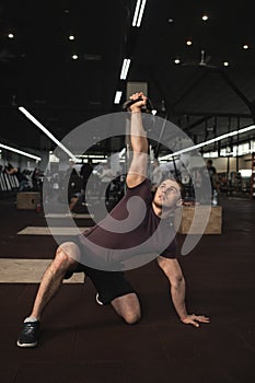 Male cross fit athlete working out at the gym photo