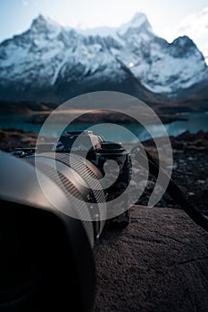 Vertical shot of a high-quality DSLR camera with a zoom lens in Torres del Paine National Park,Chile