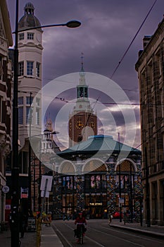 Vertical shot of historic buildings near a road at sunset in Denhaag, Netherlands