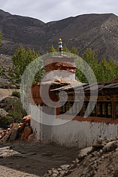 Vertical shot of the historic Tibetan Buddhist holy site Ghar Gumba Monastery in the Himalayas