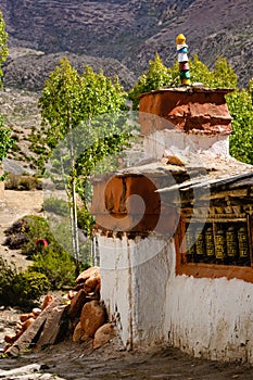 Vertical shot of the historic Tibetan Buddhist holy site Ghar Gumba Monastery in the Himalayas