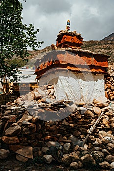 Vertical shot of the historic Tibetan Buddhist holy site Ghar Gumba Monastery in the Himalayas