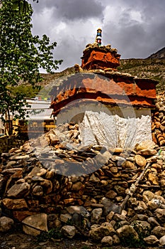Vertical shot of the historic Tibetan Buddhist holy site Ghar Gumba Monastery in the Himalayas