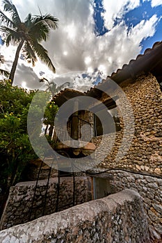 Vertical shot of a house with a balcony in Altos de Chavon village, Dominican republic