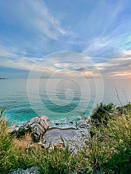 Vertical shot of an idyllic view of sunset over the empty beach