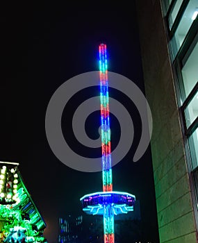 Vertical shot of an illuminated attraction in Magdeburg, Germany at night