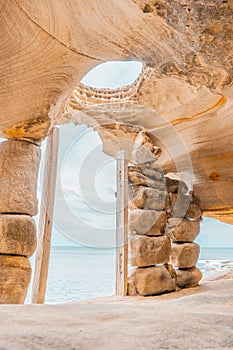 Vertical shot of the inside of the Sandstone Cliff Cape Banks in the Kamay Botany Bay National Park photo