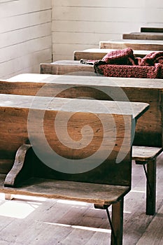 Vertical shot of the interior of a historic one-room school house from the 1800s
