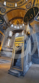 Vertical shot of the interior of the Saint Hagia Sophia with a writing
Translation: Allah