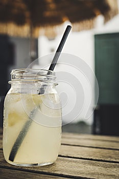 Vertical shot of a jar with homemade lemon lemonade