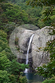 Vertical shot of Jikso Falls in Byeonsan Bando National Park, South Korea photo