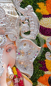 Vertical shot of The Kasba Ganapati statue's half face