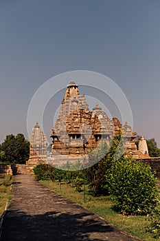 Vertical shot of the Khajuraho Group of Monuments temples in Chhatarpur district, India photo