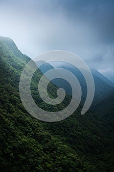 Vertical shot of Khasi and Jaintia Hills overs rainy clouds