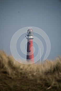 Vertical shot of the Lange Jaap Lighthouse in Huisduinen, Netherlands