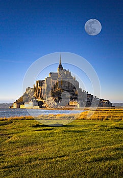 Vertical shot of the majestic Mont Saint-Michel castle, France photo