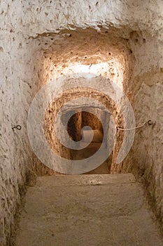 Vertical shot of a man-made cave in Alcana del Jucar, Castilia la Mancha, Spain photo