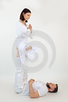 Vertical shot man and woman, family do sports exercises, pilates, yoga. Healthy lifestyle. Namaste and zen, meditation