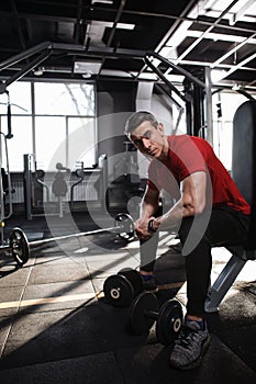 Mature male athlete working out at the gym