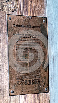 Vertical shot of a metal replica of the Declaration of Independence