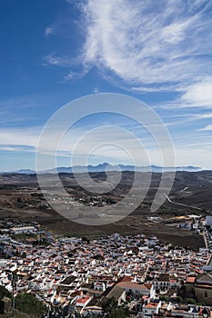 Vertical shot of modern buildings near the mountains in Espera, Spain photo