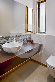 Vertical shot of the modern sink in the bathroom of an apartment