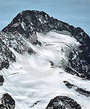 Vertical shot of mountains near ski resort Les deux Alpes in winter, France