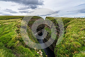 Vertical shot of a narrow gorge at Duncansby Head near John o\'Groats in Caithness, Scotland