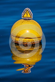 Vertical shot of a nautical buoy floating in the water of Lake Geneva in Switzerland