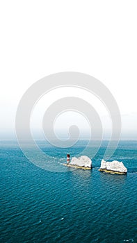 Vertical shot of the needles on the Isle of Wight in the United Kingdom with a white background