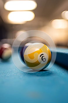 Vertical shot of the number 9 billiard ball in a blur