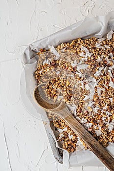 Vertical shot of an oaten breakfast in a metal plate on white background