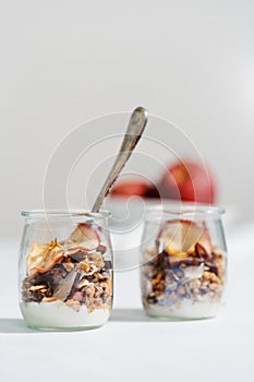 Vertical shot of an oaten breakfast with milk isolated on white background