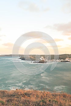 Vertical shot of the ocean between high hills in Menorca, Islas Baleares. Spain.