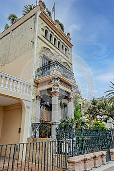 Vertical shot of an old building in El Masnou, Spain against the blue sky photo