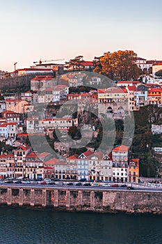 Vertical shot of the old and colorful buildings of Oporto in Portugal captured during the daytime