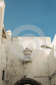 Vertical shot of old dirty buildings in the Habous District, Casablanca, Morocco photo
