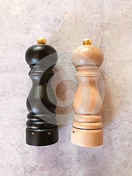 Vertical shot of Peugeot salt and pepper mill set, made of wood of high quality