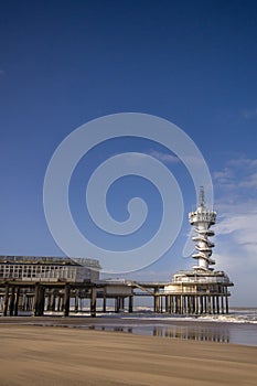 Vertical shot of the Pier Scheveningen in the Netherlands under a blue sky