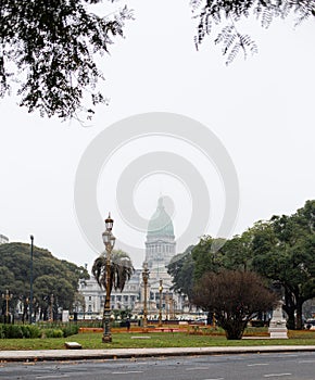 Vertical shot of Plaza del Congreso park under a white sky