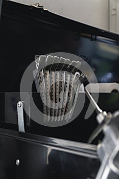 Vertical shot of  professional hairdressing duck mouth or hairclips for hairstyling in a barbershop