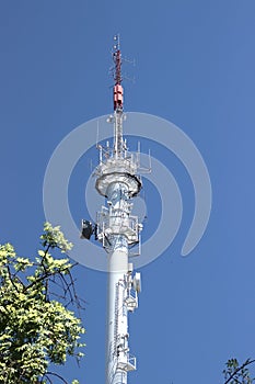 Vertical shot of the Radio broadcasting mast against the blue sky