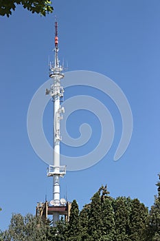 Vertical shot of the Radio broadcasting mast against the blue sky